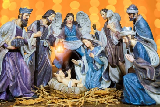 Christmas Manger scene with figurines including Jesus, Mary, Joseph and sheep. Focus on mother!