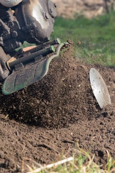 A man mills a garden in spring,picture cut