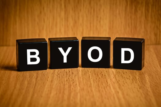 BYOD or Bring your own device text on black block
