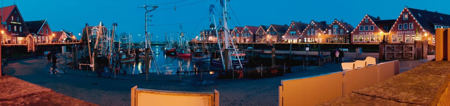 Neuharlingersiel,Germany - January 1,2014: Panoramic view of the port of Neuharlingersiel in the evening-dawn