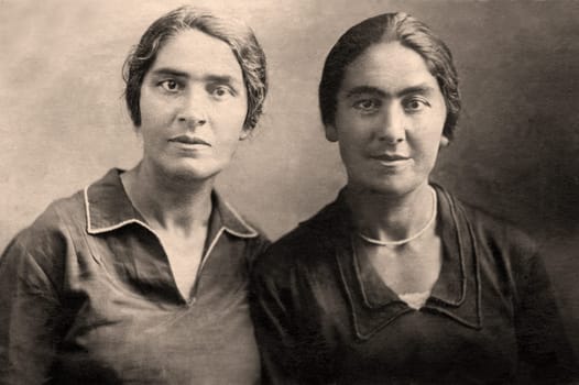 Armenian sisters close up.