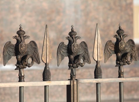 fence decorations with Russian  Double Headed Eagle close to