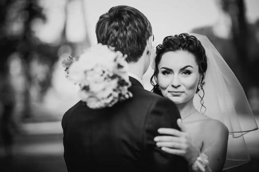 Black white photography wedding beautiful young couple stand on background forest