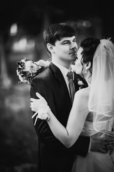 Black white photography wedding beautiful young couple stand on background forest