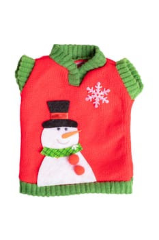 Christmas decorations background. Toy pullover with snowman isolated on a white background.