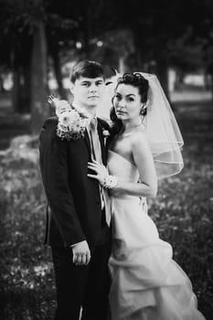 Black white photography wedding beautiful young couple stand on background forest