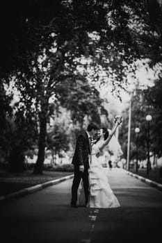 Black white photography beautiful young couple stand on background forest