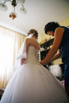 Mom puts young bride at a wedding