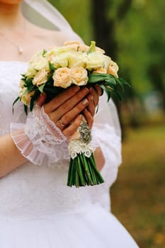 young bride holding a bouquet of flowers