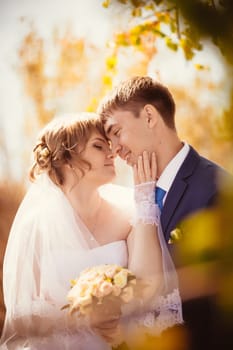 young bride and groom on the bluer background