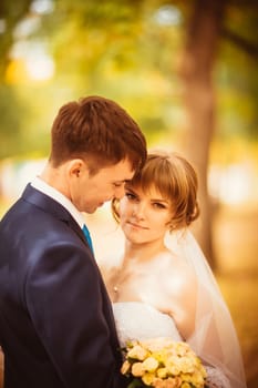 young bride and groom on the bluer background