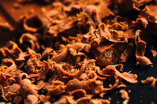 lot of chocolate chips on a black background