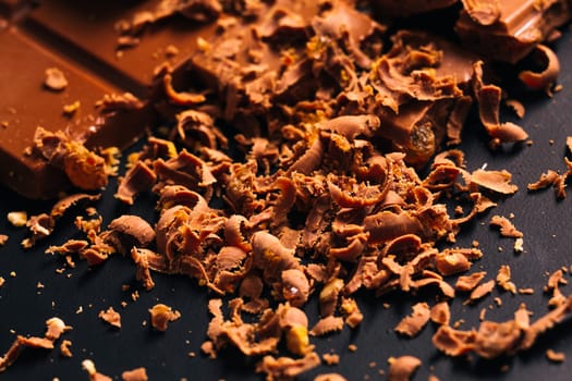lot of chocolate chips on a black background