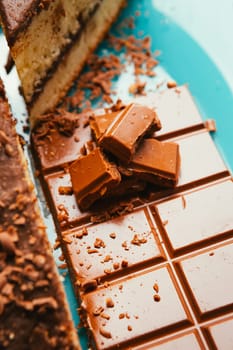 sweet cake and chocolate chips on a blue plate