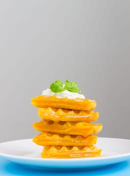 5 Pieces Heart Shape Waffle and Peppermint on Grey Background Portrait. Heart shape waffle dessert for food and dessert category