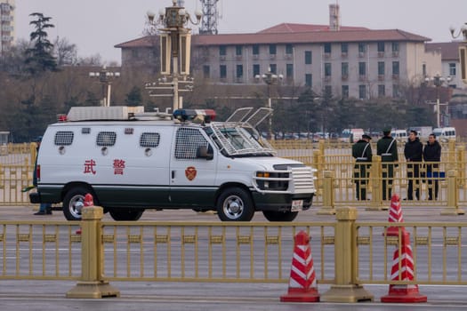 Beijing, China - Mar 16, 2018: Vehicle and guards of the Chinese People's Armed Police Force, known as PAP, outside the Tienanmen Square in Beijing.