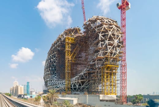 Dubai, UAE - Oct 16, 2018: View of the Museum of the Future under construction in Dubai. It is a groundbreaking design in architecture. It has an oval torus shape with an open center.