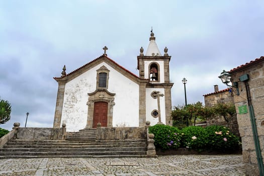 Facade of the Church of Our Lady of the Assumption, originally a Romanesque church of the 12th century, in Linhares da Beira, Gouveia, Portugal