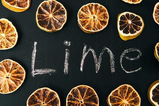 many cut orange circle on a black background board