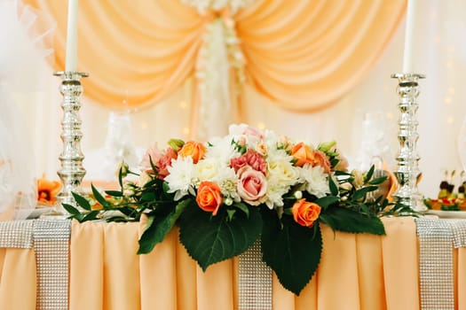 beautiful wedding table decoration decor of the newlyweds in peach tones