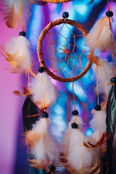 Dream catcher on the bright multicolored background