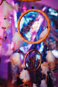 Dream catcher on the bright multicolored background