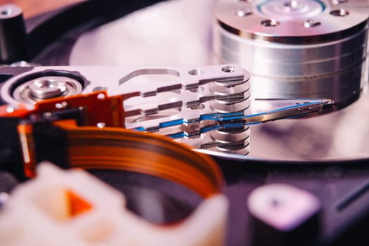 Internal hard disk closeup on wooden background