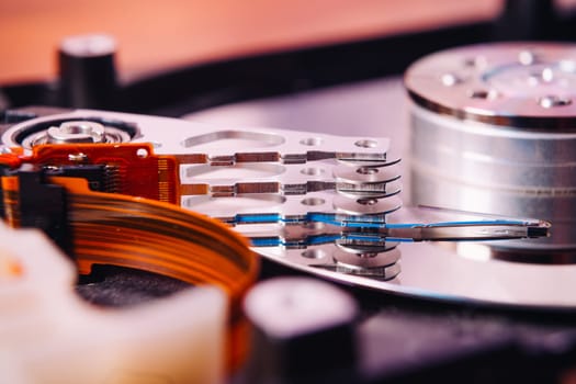 Internal hard disk closeup on wooden background