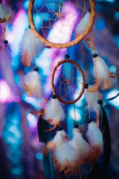 Dream catcher on the bright multicolored background