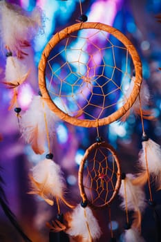 Dream catcher on the bright multicolored background