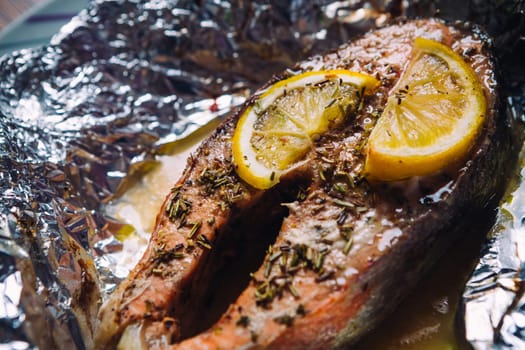 fish steak baked with lemon and herbs in foil