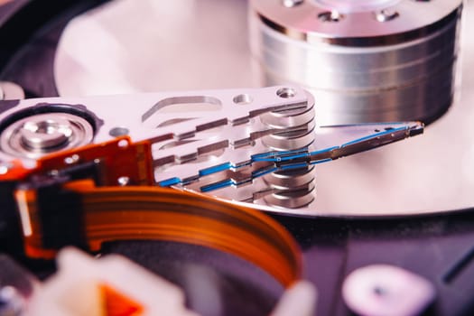 Internal hard disk closeup on wooden background