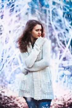 girl in warm sweater on the winter background