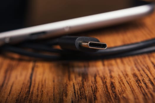 new tablet with built-in usb-c on wooden background