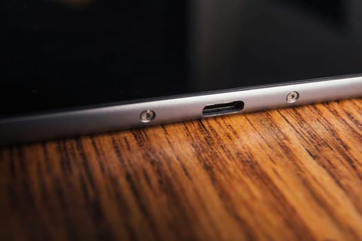 new tablet with built-in usb-c on wooden background