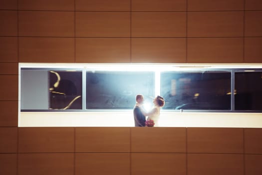 bride and groom on the background of the hotel