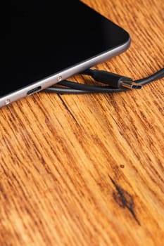 new tablet with built-in usb-c on wooden background