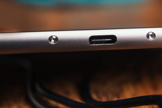 new tablet with built-in usb-c on wooden background