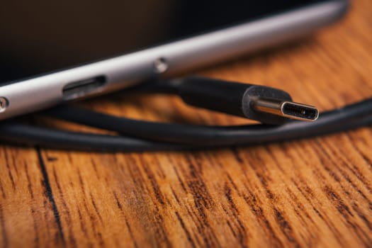 new tablet with built-in usb-c on wooden background