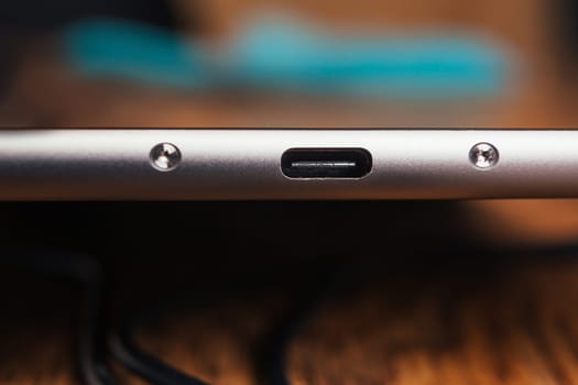 new tablet with built-in usb-c on wooden background