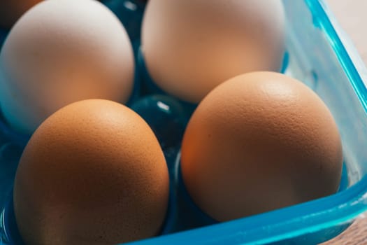 fresh rural eggs in a blue plastic bag