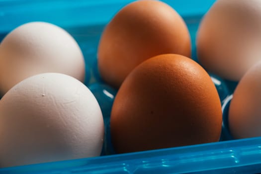 fresh rural eggs in a blue plastic bag