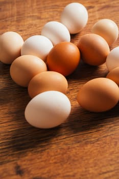 Fresh rural eggs on the wooden background