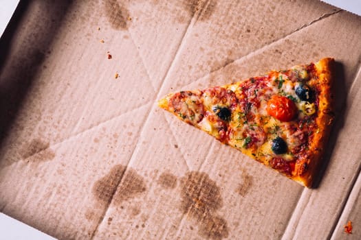 pieces of pizza with olives, cheese and salami sausage