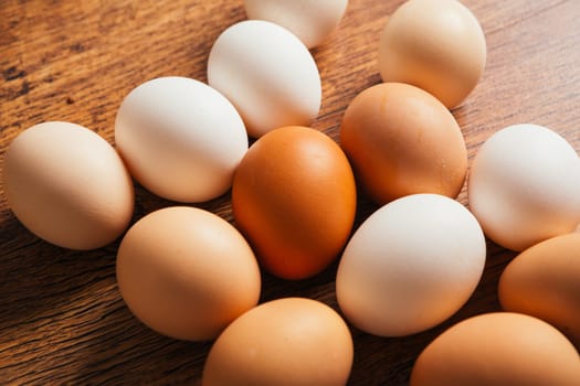 Fresh rural eggs on the wooden background