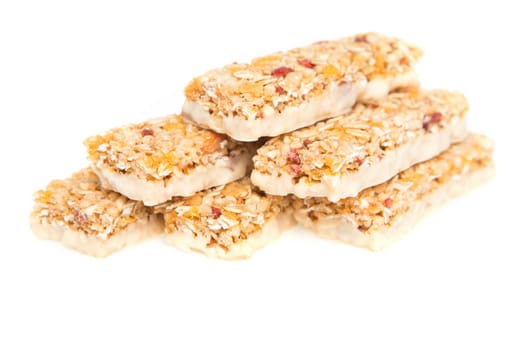 muesli bars with dried fruit on isolated background