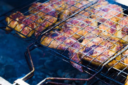 pieces of fried chicken on the grill barbecue