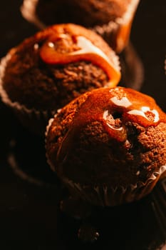 Sweet homemade chocolate muffin with caramel crumble on the top,selective focus