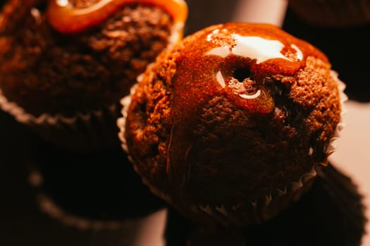 Sweet homemade chocolate muffin with caramel crumble on the top,selective focus