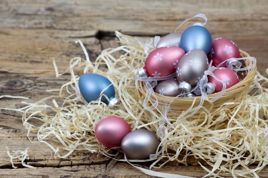 Easter decoration -  colorful painted eggs in a basket